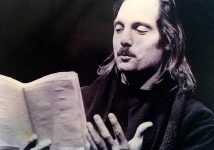 Robert Colt on stage, black and white, deep in concentration